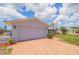 Spacious two-car garage with brick-paved driveway and well-manicured landscaping at 4433 38Th S Way, St Petersburg, FL 33711