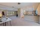 Bright living room leads to the kitchen area with breakfast bar and views of the neighborhood at 4433 38Th S Way, St Petersburg, FL 33711