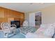 Cozy living area with wood paneling, a fireplace, and comfortable seating at 4433 38Th S Way, St Petersburg, FL 33711