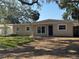 A single-story home with a charming front exterior and bright white-trimmed windows at 4716 W Vasconia St, Tampa, FL 33629