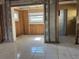 An interior view reveals a space with tiled floors, awaiting customization and design at 4716 W Vasconia St, Tampa, FL 33629
