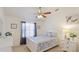 Charming bedroom featuring a ceiling fan, ample natural light, and neutral tones at 4909 Linsey Ct # 0, Sarasota, FL 34243