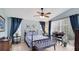 Comfortable bedroom featuring a ceiling fan, large windows, and tasteful decor with plenty of natural light at 4909 Linsey Ct # 0, Sarasota, FL 34243