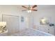 Bright bedroom with a ceiling fan, closet, and decorative furniture at 4909 Linsey Ct # 0, Sarasota, FL 34243