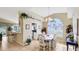 Inviting dining room with a modern chandelier and natural light from a large window at 4909 Linsey Ct # 0, Sarasota, FL 34243