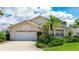 Charming single Gathering home featuring a 2-car garage and well-manicured landscaping with tropical plants at 4909 Linsey Ct # 0, Sarasota, FL 34243