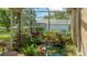 Enclosed garden area with a relaxing pond and waterfall feature, with lush plants and garden art at 4909 Linsey Ct # 0, Sarasota, FL 34243