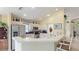 Efficient kitchen featuring white cabinetry and stainless-steel appliances with a breakfast bar at 4909 Linsey Ct # 0, Sarasota, FL 34243