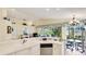 Bright kitchen with a breakfast bar that connects to the living room and dining room at 4909 Linsey Ct # 0, Sarasota, FL 34243