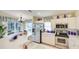 Well-equipped kitchen featuring stainless steel appliances, white cabinets, and plenty of counter space at 4909 Linsey Ct # 0, Sarasota, FL 34243