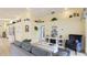 Comfortable living room with high ceilings, tile floors, and stylish decor, perfect for relaxing and entertaining at 4909 Linsey Ct # 0, Sarasota, FL 34243