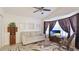 Cozy living room featuring a comfortable couch, charming decor, and a sunlit bay window at 4909 Linsey Ct # 0, Sarasota, FL 34243