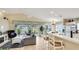 Open living space featuring tile floors, a fireplace, and a view of the screened patio and waterfront at 4909 Linsey Ct # 0, Sarasota, FL 34243