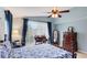 Serene bedroom with an ensuite bathroom, a ceiling fan and a walkout to the lanai at 4909 Linsey Ct # 0, Sarasota, FL 34243