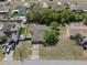 Aerial shot showcasing the property's location with surrounding homes, mature trees, and street access at 5263 Kirkwood Ave, Spring Hill, FL 34608