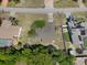 Aerial view of a charming home showcasing its roof, fenced backyard and surrounding landscaping at 5263 Kirkwood Ave, Spring Hill, FL 34608