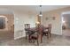 Charming dining area with a wooden table and four chairs, perfect for Gathering meals at 5263 Kirkwood Ave, Spring Hill, FL 34608