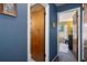 Blue hallway leading to bedrooms at 5263 Kirkwood Ave, Spring Hill, FL 34608