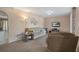 Cozy living room features a comfortable sofa, chair, and a television for relaxation at 5263 Kirkwood Ave, Spring Hill, FL 34608