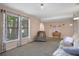 Spacious living room filled with natural light from large windows at 5263 Kirkwood Ave, Spring Hill, FL 34608