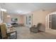 Bright living room with natural light, comfortable seating, and a TV for entertainment at 5263 Kirkwood Ave, Spring Hill, FL 34608