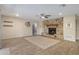 Spacious living room with a stone fireplace and wood-look flooring at 5263 Kirkwood Ave, Spring Hill, FL 34608