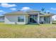 Expansive backyard with a screened lanai, perfect for relaxing and grilling outdoors at 5518 72Nd E Ter, Ellenton, FL 34222