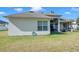 Spacious backyard featuring a well-maintained lawn and a screened-in lanai at 5518 72Nd E Ter, Ellenton, FL 34222