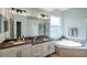Elegant bathroom with double vanity, soaking tub, and walk-in shower at 5518 72Nd E Ter, Ellenton, FL 34222