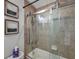 Bathroom tub and shower with tile surround and glass enclosure at 5518 72Nd E Ter, Ellenton, FL 34222