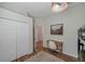 Bedroom with a closet, a desk, and a view of the hallway at 5518 72Nd E Ter, Ellenton, FL 34222