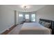 Bright bedroom with decorative windows and area rug at 5518 72Nd E Ter, Ellenton, FL 34222