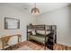 Bright bedroom featuring a bunk bed, desk, and ample natural light at 5518 72Nd E Ter, Ellenton, FL 34222