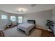 Sunlit bedroom with large windows, plush rug, and modern furnishings at 5518 72Nd E Ter, Ellenton, FL 34222
