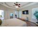 Bright bedroom with wood floors, television, and crib at 5518 72Nd E Ter, Ellenton, FL 34222
