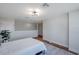 Bright bedroom showcases wood floors and a stylish ceiling light at 5518 72Nd E Ter, Ellenton, FL 34222