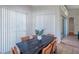 Modern dining room has a table with seating for six and sliding glass doors to outdoor space at 5518 72Nd E Ter, Ellenton, FL 34222