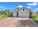 Charming home with a brick driveway, three-car garage, and well-maintained landscaping at 5518 72Nd E Ter, Ellenton, FL 34222