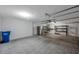 Spacious garage with a refrigerator and shelving units at 5518 72Nd E Ter, Ellenton, FL 34222