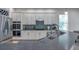 Modern kitchen features stainless steel appliances, stone countertops, and mosaic backsplash at 5518 72Nd E Ter, Ellenton, FL 34222