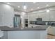 Modern kitchen with white cabinets, stainless steel appliances, and stylish backsplash at 5518 72Nd E Ter, Ellenton, FL 34222