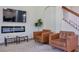 Comfortable living room showcasing a sleek fireplace, modern television, and plush seating area at 5518 72Nd E Ter, Ellenton, FL 34222