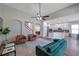 Open concept living room with modern fixtures, staircase, and an easy flow to kitchen at 5518 72Nd E Ter, Ellenton, FL 34222