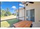 Screened-in patio with dining area, perfect for enjoying outdoor meals with scenic backyard views at 5518 72Nd E Ter, Ellenton, FL 34222