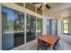 Spacious covered patio with large sliding glass doors, offering seamless indoor-outdoor living and dining at 5518 72Nd E Ter, Ellenton, FL 34222