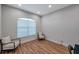 Cozy sitting area with wood flooring, recessed lighting, and two chairs at 5518 72Nd E Ter, Ellenton, FL 34222