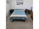 Bedroom with bed, side tables, and guitar at 5623 80Th N St # 306, St Petersburg, FL 33709