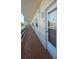 Exterior hallway with condo door entrance featuring apartment number 306 at 5623 80Th N St # 306, St Petersburg, FL 33709