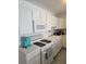 Bright kitchen featuring white cabinets, modern appliances, and ample counter space at 5623 80Th N St # 306, St Petersburg, FL 33709