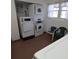 Bright laundry room with a set of washers and dryers plus a set of chairs at 5623 80Th N St # 306, St Petersburg, FL 33709